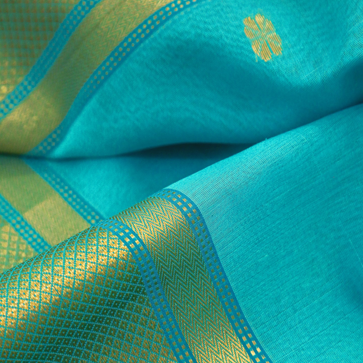 Turquoise Silk Maheshwari Saree with Floral Buttas